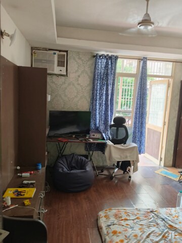 Living Room in 2 BHK Apartment at Mahagun Mascot, Sain Vihar – for Rent