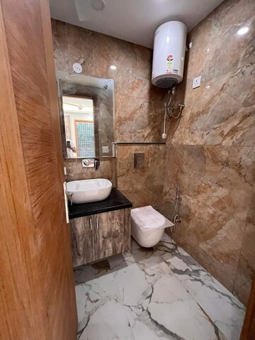 Bathroom in 3 BHK Builder Floor at Freedom Fighters Enclave – for Rent