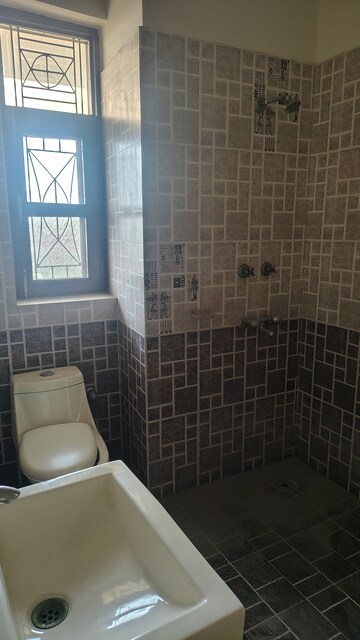 Bathroom in 4 BHK Apartment at Sector 9 Wave City – for Sale
