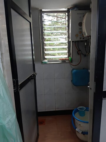 Bathroom in 2 BHK Apartment at Vile Parle East – for Rent