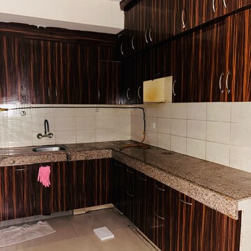 Kitchen in 2 BHK Apartment at Logix Blossom Greens, Sector 143 – for Sale