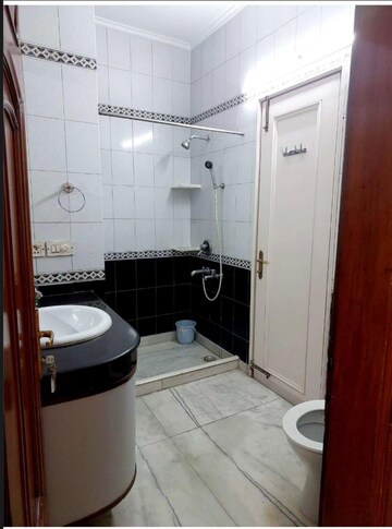 Bathroom in 4 BHK Builder Floor at Green Park Extension – for Rent