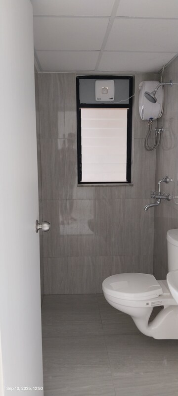 Bathroom in 1 BHK Apartment at Runwal Gardens, Dombivli East – for Rent