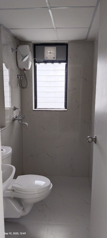 Bathroom in 1 BHK Apartment at Runwal Gardens, Dombivli East – for Rent