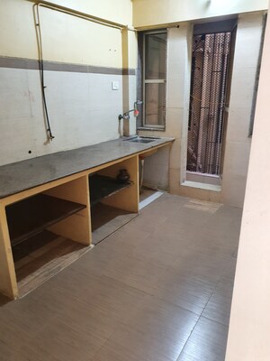 Kitchen in 1 BHK Apartment at Charkop Gaon – for Sale