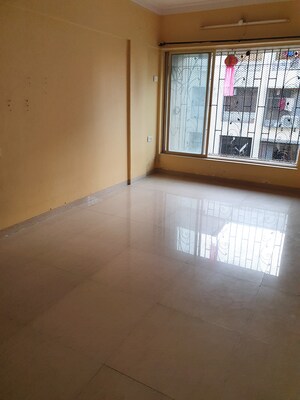 Living Room in 1 BHK Apartment at Charkop Gaon – for Sale