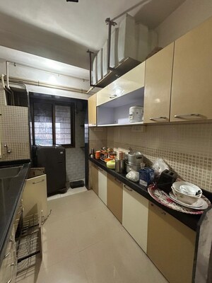 Kitchen in 3 BHK Apartment at Sudarshan Sky Garden, Ghodbunder Road – for Sale
