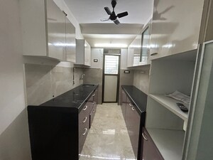 Kitchen in 2.5 BHK Apartment at Madhav Palacia, Ghodbunder Road – for Sale