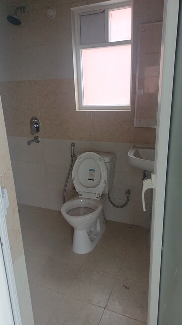Bathroom in 2 BHK Apartment at Surat Residency, Vrinda Van Colony – for Sale