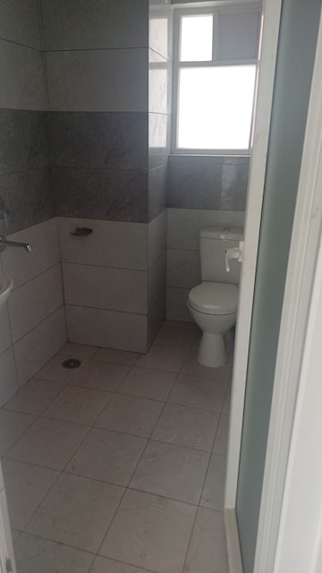 Bathroom in 2 BHK Apartment at Surat Residency, Vrinda Van Colony – for Sale