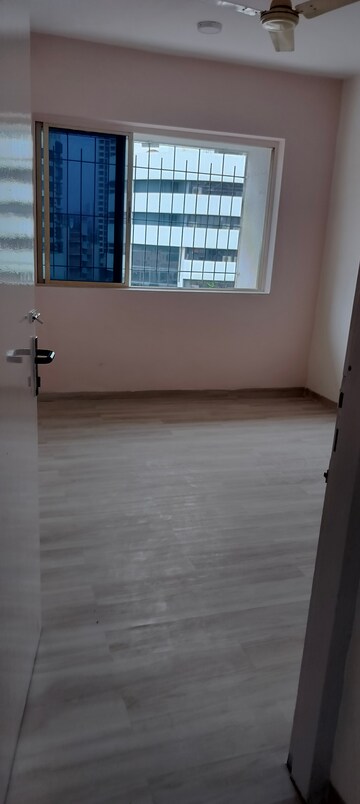 Room in 2 BHK Apartment at Grenville CHS, Andheri West – for Rent