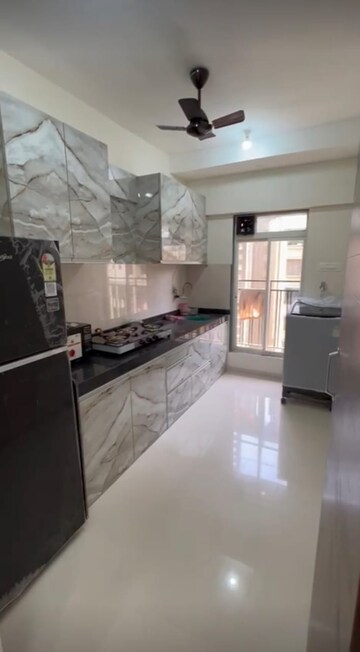 Kitchen in 2 BHK Apartment at Bini Winspace Amelio, Andheri West – for Rent