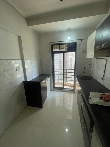Kitchen in 1 BHK Apartment at RNA NG Canary, Mira Road – for Sale