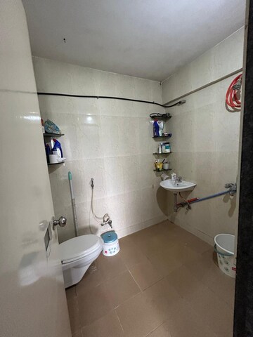 Bathroom in 2 BHK Apartment at Marigold CHS Anand Nagar, Anand Nagar – for Sale