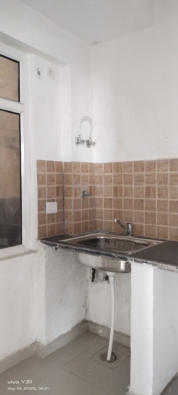 Kitchen in 2 BHK Apartment at Mahagun Mywoods, Sector 16c Greater Noida – for Rent