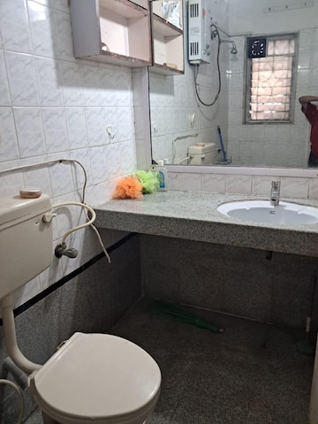 Bathroom in 2 BHK Apartment at Palace Orchard CHS, Mohammadwadi – for Rent