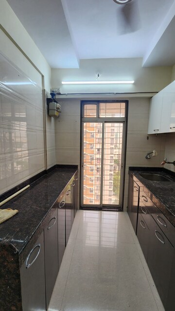 Kitchen in 2 BHK Apartment at Shimpoli Niranjan CHS, Borivali West – for Rent