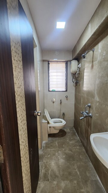 Bathroom in 2 BHK Apartment at Shimpoli Niranjan CHS, Borivali West – for Rent