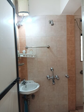Bathroom in 1 BHK Apartment at Dheeraj Valley, Goregaon East – for Rent