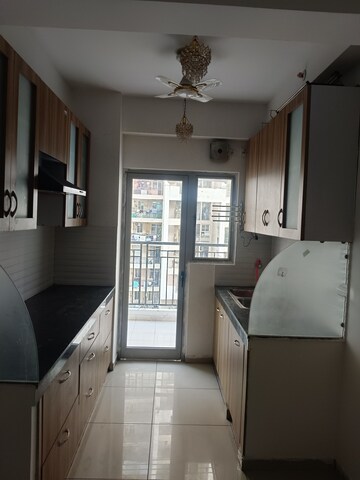 Kitchen in 2.5 BHK Apartment at Gulshan Bellina, Sector 16 Greater Noida – for Rent