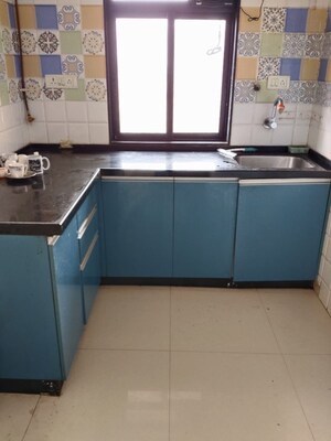 Kitchen in 1 BHK Apartment at Raunak Unnathi Greens, Kasarvadavali – for Sale