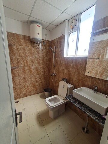 Bathroom in 3 BHK Apartment at Sushma Elite Cross, Dhakoli – for Rent