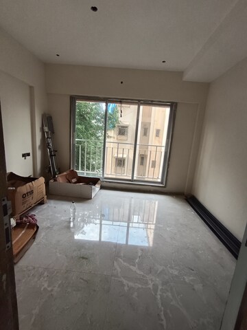 Living Room in 1 BHK Apartment at AMO Swapna Sudha CHSL, Andheri East – for Sale