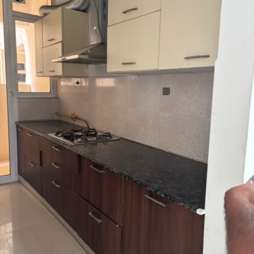 Kitchen in 3 BHK Apartment at Mahagun Mirabella Highrise, Sector 79 – for Rent