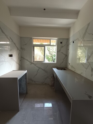 Kitchen in 2 BHK Apartment at AMO Swapna Sudha CHSL, Andheri East – for Sale