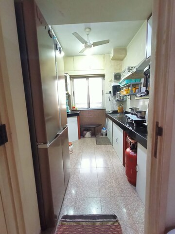 Kitchen in 2 BHK Apartment at Siddhachal Phase 5 CHS Ltd, Vasant Vihar – for Sale