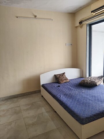 Bedroom in 1 BHK Apartment at Ruparel Elara, Kandivali West – for Rent