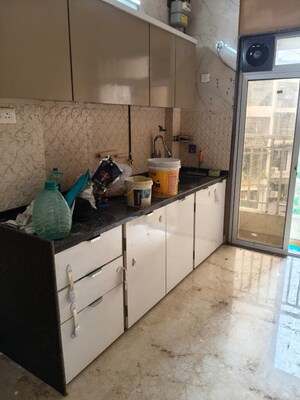 Kitchen in 2 BHK Apartment at Om Prabhu Manohar CHS, Seawoods Sector 50 – for Rent