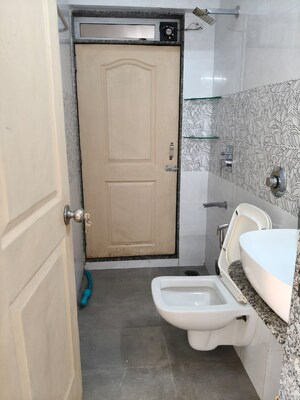 Bathroom in 2 BHK Apartment at Om Prabhu Manohar CHS, Seawoods Sector 50 – for Rent
