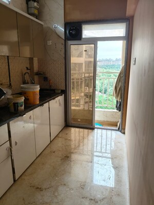 Kitchen in 2 BHK Apartment at Om Prabhu Manohar CHS, Seawoods Sector 50 – for Rent