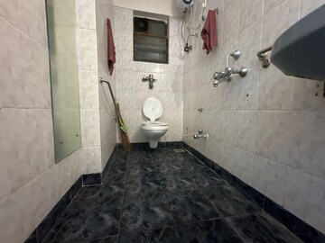 Bathroom in 2 BHK Apartment at Silver Arch Eden woods, Andheri West – for Rent