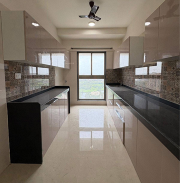Kitchen in 2 BHK Apartment at Raj Infinia, Evershine Nagar – for Rent