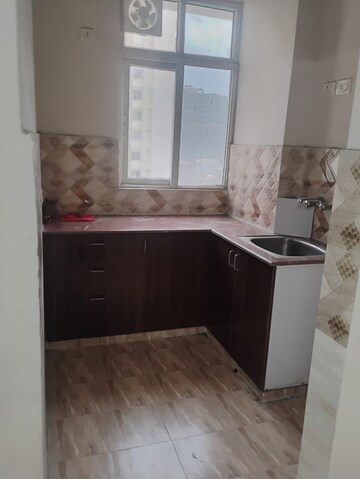 Kitchen in 2 BHK Apartment at Amrapali Golf Homes, Sector 4 Greater Noida – for Rent