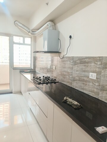 Kitchen in 4 BHK Apartment at Shapoorji Pallonji Joyville Phase 2, Sector 102 – for Rent