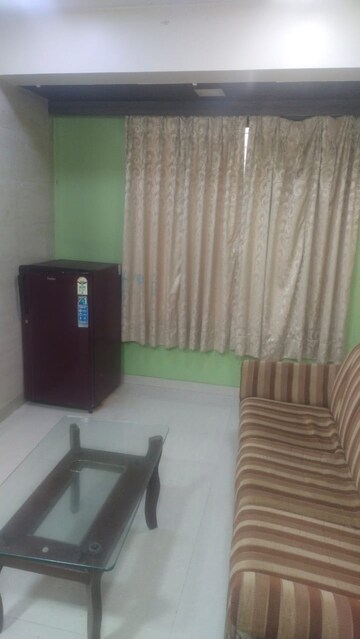 Living Room in 1 BHK Apartment at Kopar Khairane – for Rent