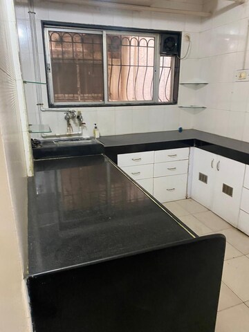 Kitchen in 2 BHK Apartment at Planet Millennium CHS, Pimple Saudagar – for Rent