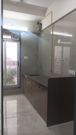 Kitchen in 2 BHK Apartment at Amar Om Vasudev CHS, Borivali West – for Sale