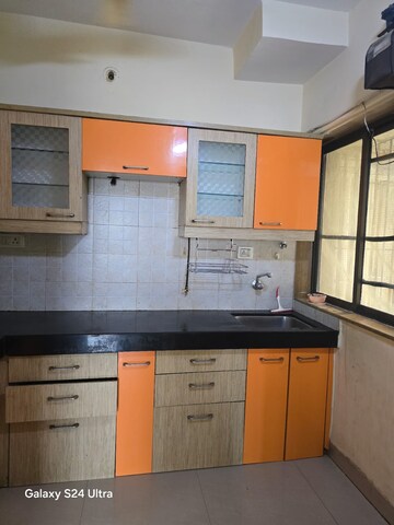Kitchen in 2 BHK Apartment at Runwal Garden City, Balkum Pada – for Rent