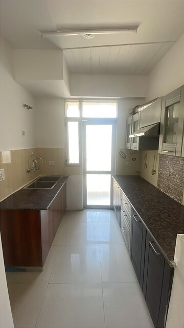 Kitchen in 2 BHK Apartment at Panchsheel Greens, Sector 16 Greater Noida – for Sale