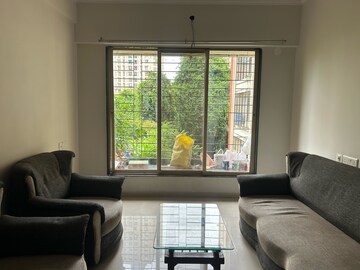 Living Room in 2 BHK Apartment at Unique Greens Ghodbunder Road, Parkwoods – for Rent