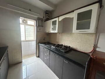 Kitchen in 2 BHK Apartment at Unique Greens Ghodbunder Road, Parkwoods – for Rent