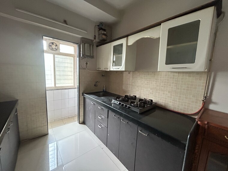 Kitchen, unique-greens-ghodbunder-road 2 Bedroom 628 Sq.Ft. Apartment In Parkwoods Thane 9207928