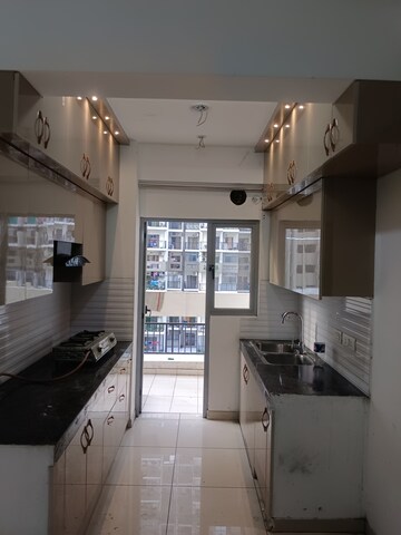 Kitchen in 3 BHK Apartment at Gulshan Bellina, Sector 16 Greater Noida – for Rent