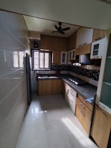 Kitchen in 2.5 BHK Apartment at Runwal Garden City, Balkum Pada – for Rent
