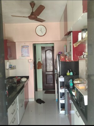 Kitchen in 1 BHK Apartment at Cosmos Orchid, Ghodbunder Road – for Sale