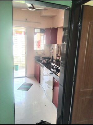 Kitchen in 1 BHK Apartment at Cosmos Orchid, Ghodbunder Road – for Sale